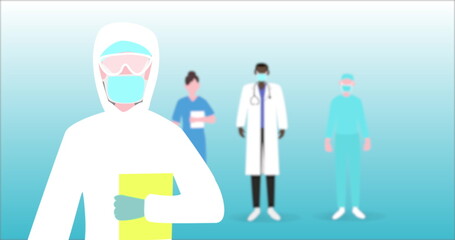 Image of a scientist standing with medical personnel standing in the back. 