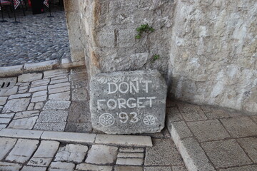 Don't forget '93 sign on old Bridge in Mostar, Bosnia and Herzegovina.