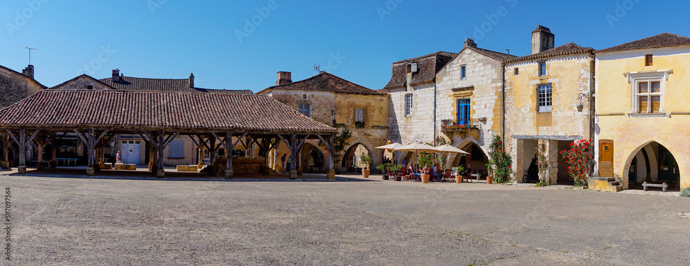 Poster panorama view of the Place des Cornieres Square in the historic city center of Monpazier