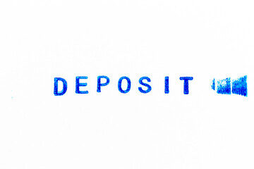 Blue color ink of rubber stamp in word deposit on white paper background