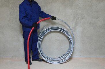 Plumber installing plastic pipes