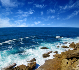 ocean wave crashing on rock