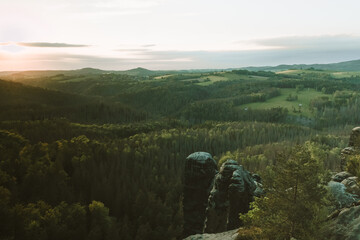 Sunset at mountain Schrammsteine (Elbsandsteingebirges). View from H&auml;ntzschelstiege in Saxon Switzerland National Park, Germany