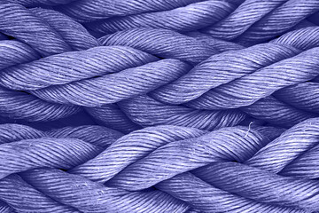 Nautical background. Old purple frayed ship rope closeup. Trendy Toned in Color of the year 2022, Very Peri.