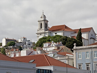 Hilltop in alfama district with church of Saint Stephen and traditional portuguese houses