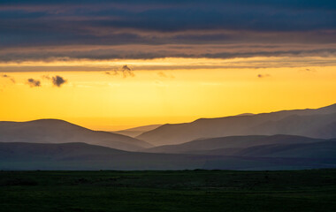 Obraz premium Dramatic sunset in Aksu Zhabagly Reserve. Fairytale evening dark panorama landscape.