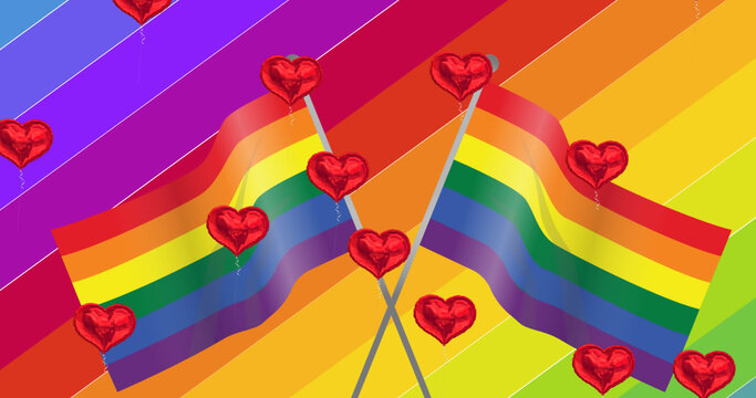 Image of falling hearts over rainbow and flags