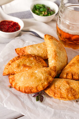 Fried chebureks, close-up, on a light background, no people,