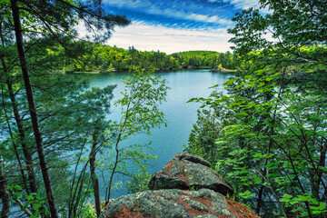 Stunning scenic landscapes from the interior of Ontario Canada in the Canadian Shield.  Explore forests and beautiful pristine lakes at sunset in a beautiful foliage of nature.  