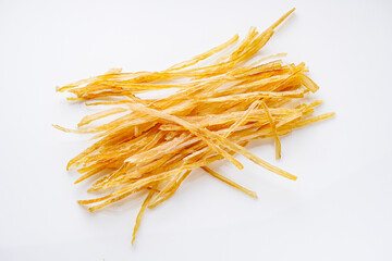 dried fish beer snack on a white acrylic background