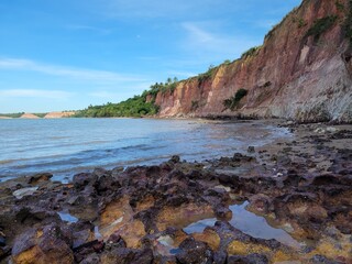 Fototapeta na wymiar Amazing cliffs of Bahia, Brazil, South America. Beach, sea, ocean. Image for geography studies and classes.
