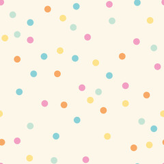 Colorful pastel dots over cream background