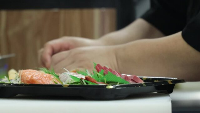 Japanese chef is making a sushi platter