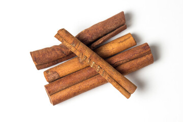 Cinnamon sticks isolated on white background. Delicious and fragrant spice.