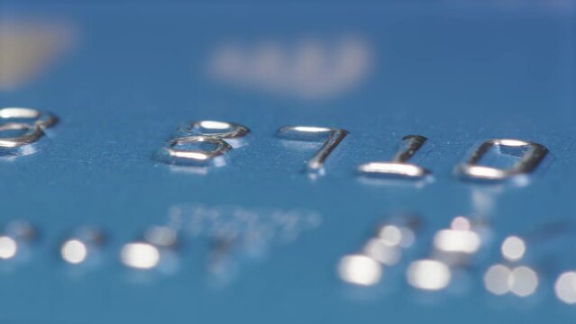 MACRO ZOOM IN TRACKING shot of a credit cards numbers