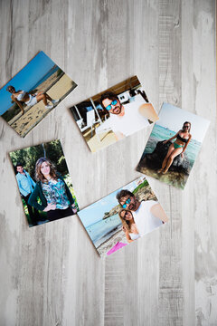 several photos of a couple in love on their summer vacations, by the beaches of Mallorca. with a gray wooden background.