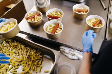pacifiers with pasta are packed in lunch boxes