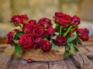 romantic red roses in a wicker basket