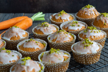 carrot muffins on a cake rack, fresh baked
