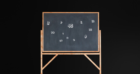 Image of numbers moving over blackboard on black background