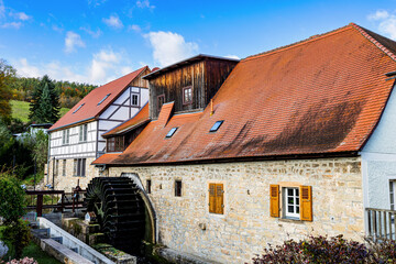 Historic water mill at the river Ilm in Buchfart, Thuringia, Germany.
