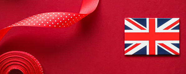 Union Jack flag of Great Britain  on red background, Queen's Platinum Jubilee and holiday...