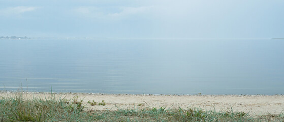 calm big lake on a foggy morning