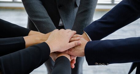close up business people putting their hands together.Unity and teamwork concept