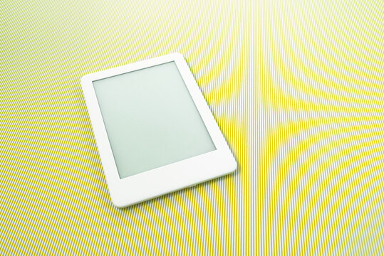 Ebook reader over green striped background