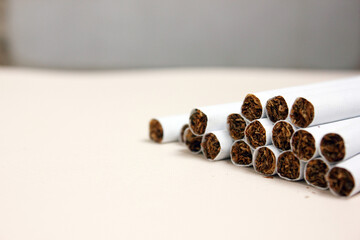 A pack of cigarettes on a white background. open pack of cigarettes. Yellow filter. Harm to health....
