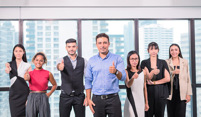 business people stand with confidence in modern office look to camera,team business showing thumb up