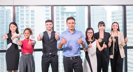 Fototapeta premium business people stand with confidence in modern office look to camera,team business showing thumb up