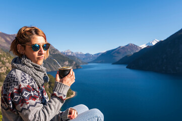 Enjoying some delicious mate on vacation between mountains and lakes. San Carlos de Bariloche,...