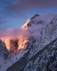 Sunrise in the mountains covered with fresh snow