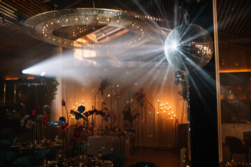 Disco ball with bright rays, night party background photo