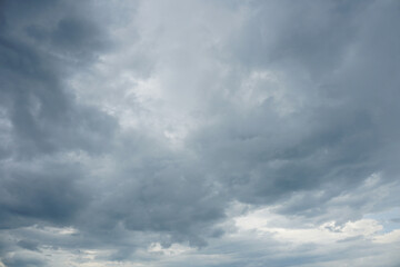 Obraz premium Nimbostratus clouds are dark, grey, featureless layers of clouds situated low in the sky.