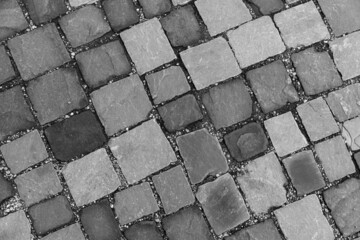 Gray paving stones on a sidewalk. Stone background