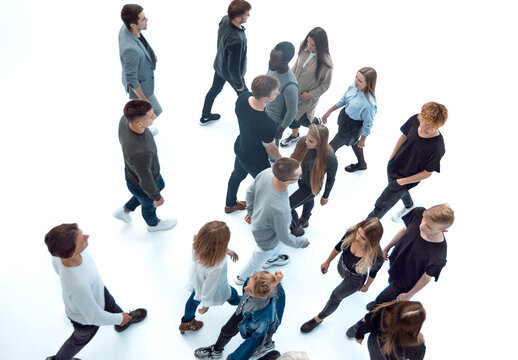 Top View . Modern Young People Walking In Opposite Directions