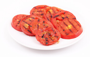 Grilled tomatoes on white background