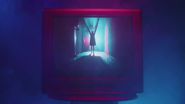 Horror film. Old tv screen with devil close-up. Creepy exorcist with horns. Bloody scary smile. Haunted house movie. 