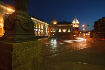 Fototapeta na wymiar Moscow, Russia - July, 27 2014: Historical buildings in Moscow center at night. Mansion on Yauza boulevard. Tram rails and light traces on foreground.