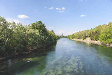 View of the Valentino park along the Po river, with a person rowing on a board. Turin, Italy. May 1, 2022.