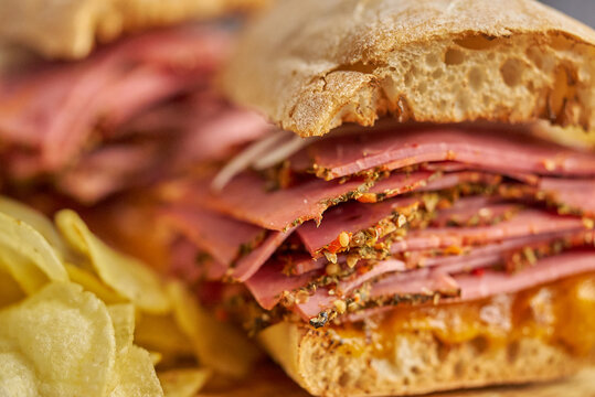 Reuben sandwich. Classic traditional American sandwich. Pastrami and corned beef on grilled bread