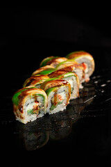 Sushi appetizing on black glossy background roll