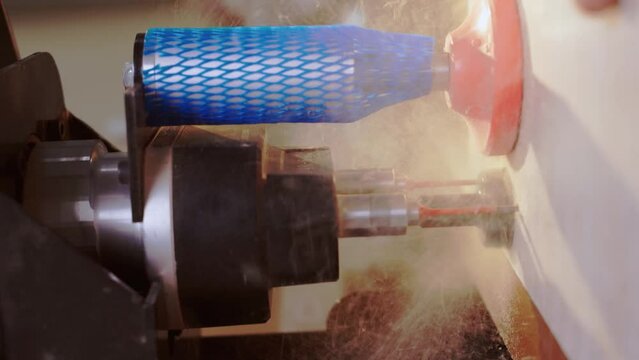 The process of drilling for hinges in a furniture factory. Drilling on a drilling and filler machine for hinges. Vertical video