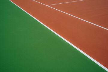 Arrière plan court de tennis vert et orange