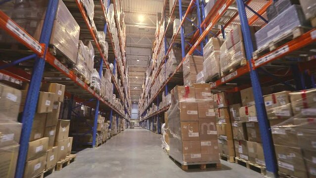 Large warehouse in the factory. High shelves in warehouse Modern warehouse. industrial interior