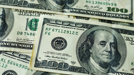 Part of 100 dollar bills scattered with Benjamin Franklin