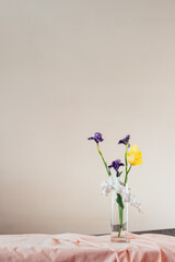 flowers in a glass vase standing on the table, abstract composition of tulip flowers