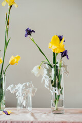 flowers in a glass vase standing on the table, abstract composition of tulip flowers
